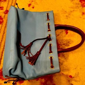 Light blue Dooney and Burke purse. New and never used.  Bundle and save